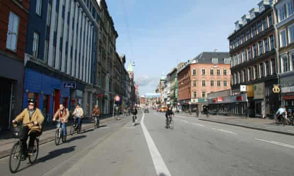 People bike to work in Copenhagen, Denmark.