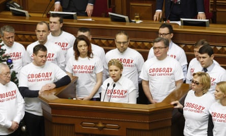 Batkivshchyna party leader Yulia Tymoshenko (centre front) wears a t-shirt reading "Freedom to Nadiya Savchenko" as she speaks at the first meeting of the Verkhovna Rada (Ukrainian Parliament) in 2015.