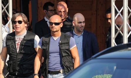 Roberto Saviano with his armed guards