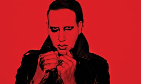 Marilyn Manson with rings, tattoos and heavy make up