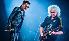 Adam Lambert with Brian May in concert in Michigan last year