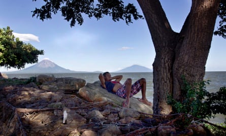 A fisherman rests by the side of Lake Nicaragua.