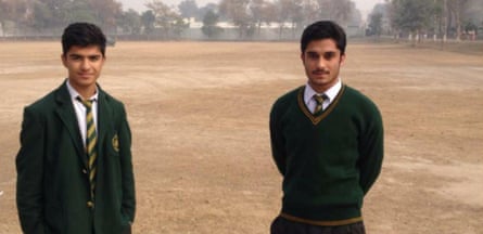 Talha Munir Paracha (left) in the restaged photograph taken after the school massacre.