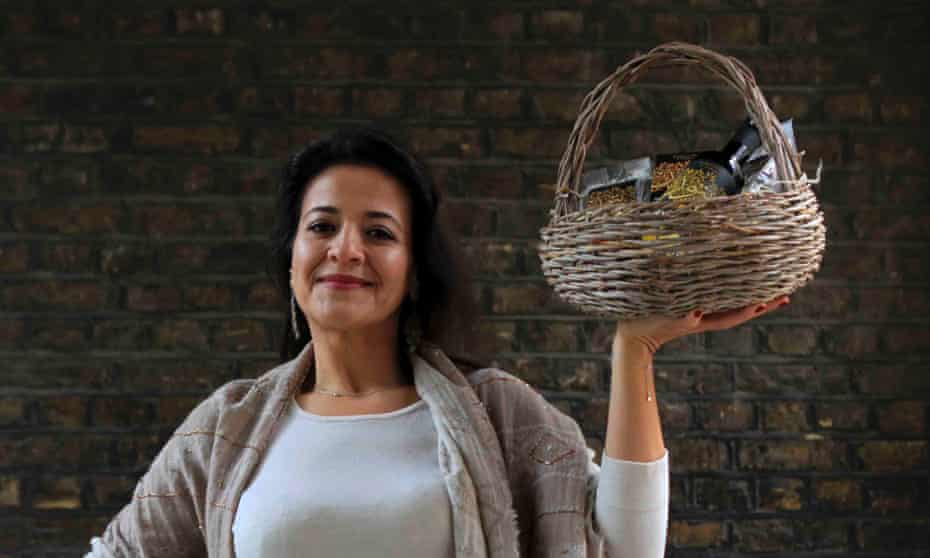 Manal Ramadan holding a basket of zaytoun ollive oil