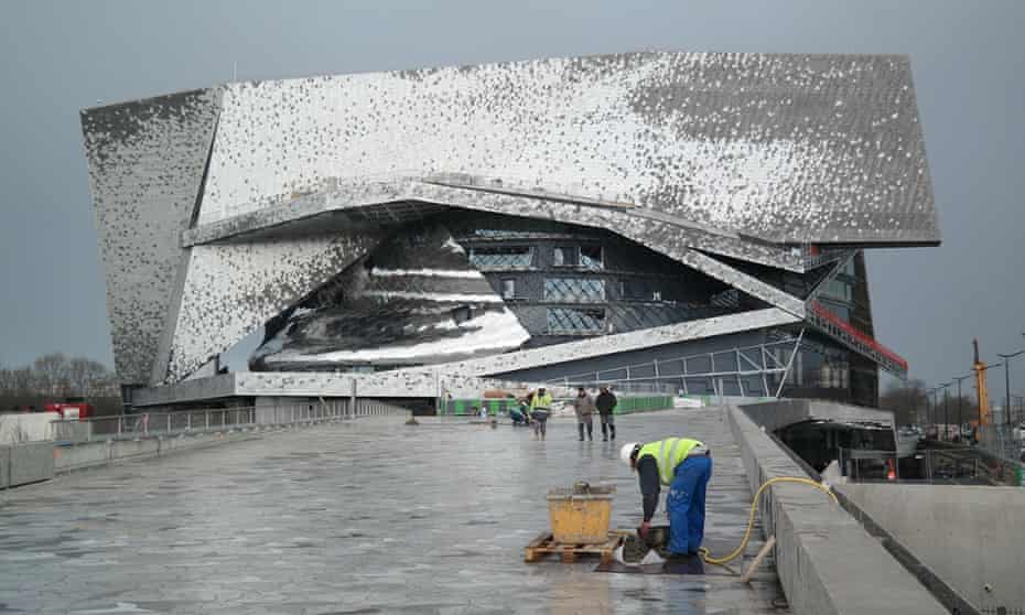 Scorched spaceship … Jean Nouvel's €390 concert hall has arrives on the edge of the city.