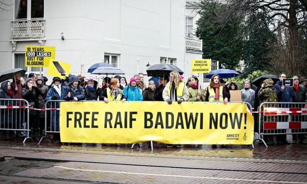 Protesters call for the release of Raif Badawi outside the Saudi embassy in The Hague, Netherlands