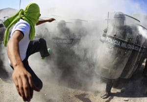 An activist kicks the shields of military police officers during a demonstration in Iguala, Guerrero. Over the past three months, dozens of town halls across Mexico’s southern state of Guerrero have been taken over by members of an amorphous movement calling for ‘popular government’.