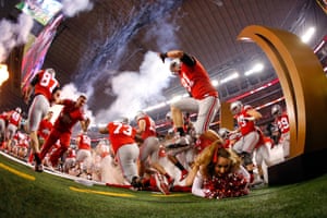 Photographer Tom Pennington was in Arlington, Texas, to capture the final of the College Football Playoff National Championship. Here, a cheerleader tumbles over as Ohio State Buckeyes run out to play Oregon. The Buckeyes won 42-20