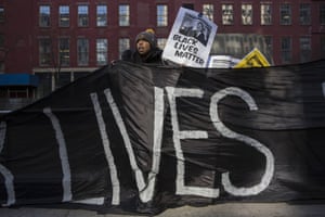 A demonstrator holds a banner during a protest against police violence towards minorities in New York. The protest was organised to coincide with Martin Luther King’s birthday. There have been continued protests in New York since last year’s shooting dead of Michael Brown in Ferguson, Missouri, and Eric Garner’s chokehold death in Staten Island, New York. Both men died at the hands of local police and in both instances, charges no charges were brought.
