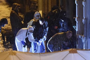 Police officers undertake a forensic investigation as rain falls in Verviers, Belgium, after two men were reported to have been killed during an anti-terror operation. Belgian police launched the ‘jihadist-related’ operation after believing that the suspected terror group was about to launch an attack.