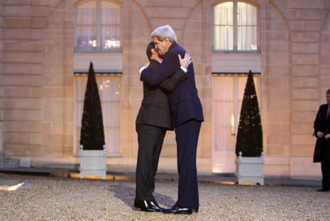 US Secretary of State John Kerry embraces French President Francois Hollande on Friday.