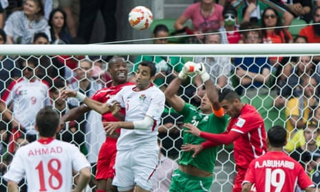 Mohammad Mustafa (third from left) of Jordan vies for the ball during a Group D match between Jordan and Palestine in Melbourne.