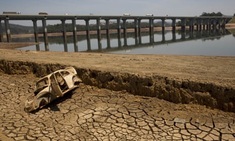 The frame of a car on the cracked earth at the bottom of the Atibainha dam, part of the Cantareira system, in October.