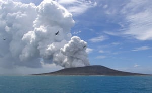 Hunga Ha'apai, Tonga: Seabirds fly on thermals from the eruption of a volcano on the uninhabited island.