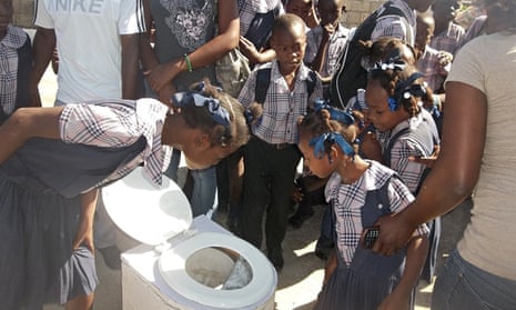 Children in Haiti learning about waste