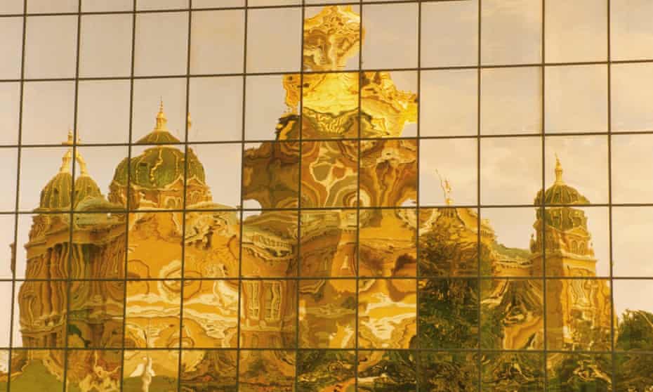 Reflection of a cathedral in an office building