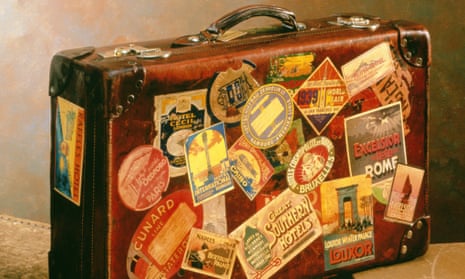 OLD SUITCASE SHOWING HOLIDAY DESTINATION LABELS.