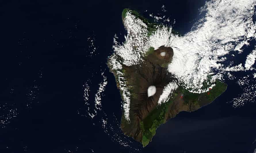 Unusual blizzard conditions turned some Hawaiian summits white with snow for Christmas day