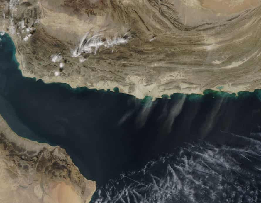 Streams of pale dust blow from Iran (in the northwest) and Pakistan (northeast) across the Arabian Sea
