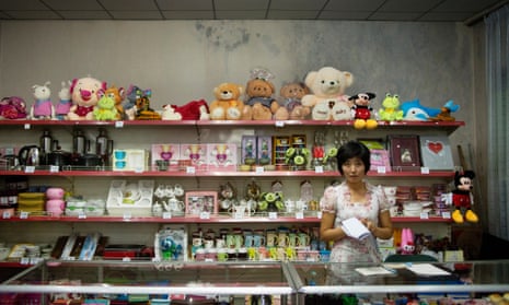 A North Korean woman works as a shopkeeper in Pyongyang.