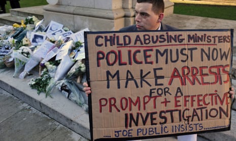 Josh Blakely, 35, who claims he was a victim of child abuse whilst living in a care home, holds a banner at Old Palace Yard in Westminster, during an event organised by the WhiteFlowers Campaign Group, in commemoration of victims and survivors of child abuse.