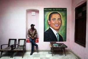 Amritsar, India Indian painter Jagjot Singh looks at his portrait of US President Barack Obama, ahead of his India visit for India's Republic Day parade