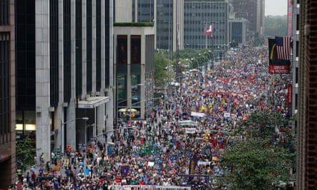 Demonstrators make their way down Sixth Avenue during the People's Climate March on 21 September 2014 in New York.