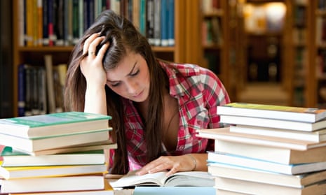 Female student surrounded by books