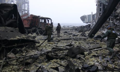 Rebel soldiers clear debris in the destroyed Donetsk airport.