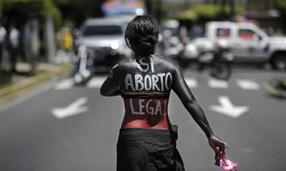A woman participates in a march in San Salvador on the international day of action for the decriminalisation of abortion.