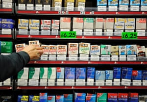 Cigarettes in a grocer's shop. It has been reported that the UK government is planning to introduce legislation for plain cigarette packaging before the general election