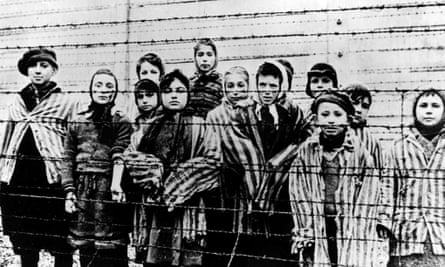 Children wearing concentration camp uniforms shortly after the liberation of Auschwitz by the Soviet army on 27 January 1945.