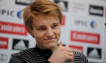 Martin Odegaard is all smiles for the media during his Real Madrid unveiling.