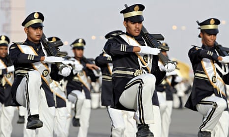 Members of the Saudi police force march during their graduation ceremony in Mecca