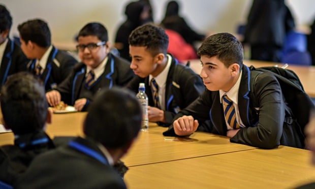 Students relax in the canteen at St Alban's academy in Birmingham