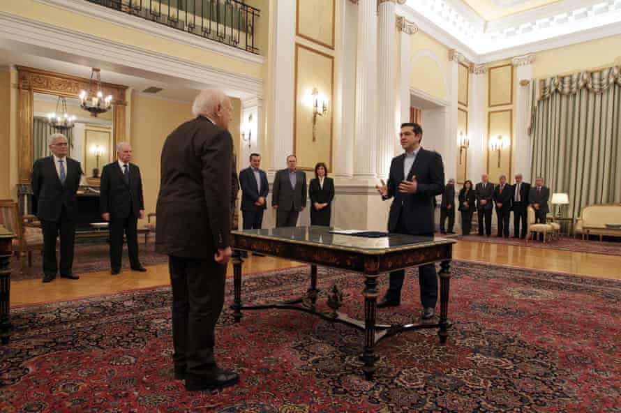 Greek radical leftist party SYRIZA leader Alexis Tsipras (R) is sworn-in as Prime Minister in the presence of Greek President Karolos Papoulias (L) at the Presidential Palace in Athens, Greece, 26 January 2015.