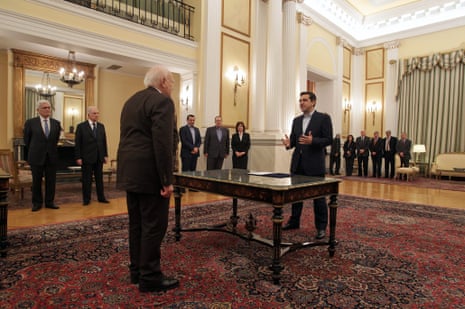 Greek radical leftist party SYRIZA leader Alexis Tsipras (R) is sworn-in as Prime Minister in the presence of Greek President Karolos Papoulias (L) at the Presidential Palace in Athens, Greece, 26 January 2015.