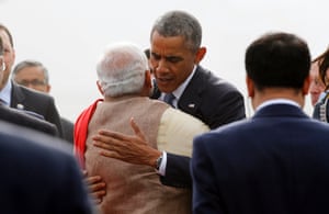 President Obama hugs India's Prime Minister Narendra Modi as he arrives at Air Force Station Palam in New Delhi, January 25