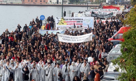 Demonstrators shout slogans as they march in Thessaloniki on  November 24, 2012, during a protest against efforts by Hellenic Gold, a subsidiary of the Canadian firm Eldorado Gold, to mine the Skouries quarry on Mount Kakkavos, in the Halkidiki Peninsula in Northern Greece.