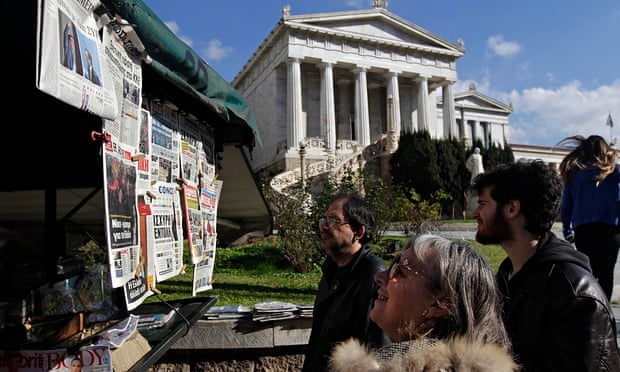 People looking at newspapers in Athens