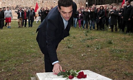 Alexis Tsipras places flowers on the National Resistance Memorial in Kaisariani on Monday.