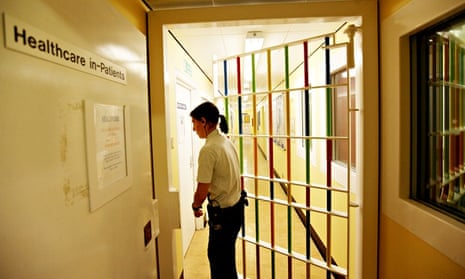 prison guard locks a door