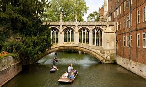 Punts drift under the Bridge of Sighs at St John's College, Cambridge.