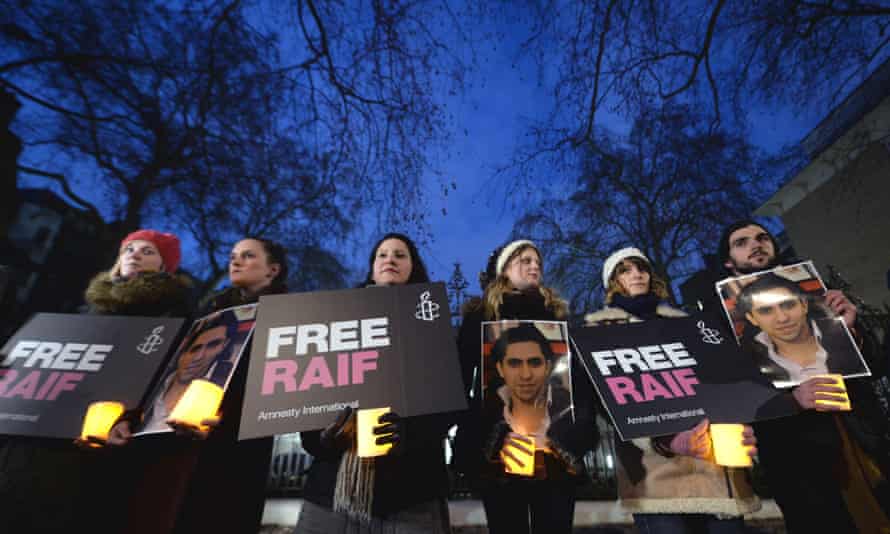 Protesters outside the Saudi embassy in London for a vigil for the blogger Raif Badawi.