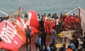 Wreckage from AirAsia flight 8501 is lifted on to a ship at sea south of Borneo island on 10 January.