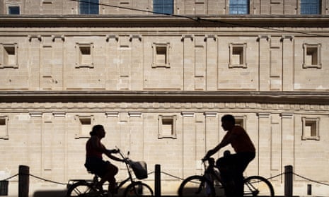 Cyclists on Seville's Avenida de la Constitucion.