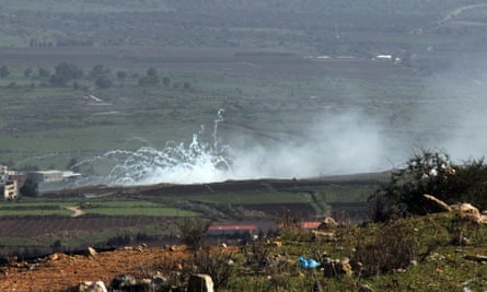 Smoke rises from farms on the junction between Lebanon, Israel and Syria.