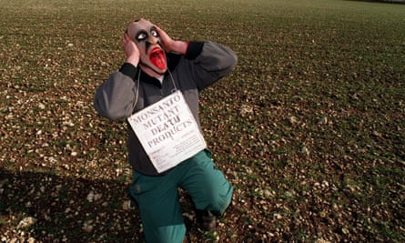 An environmental campaigner protests against Monsanto in a field near Rothwell in Lincs.