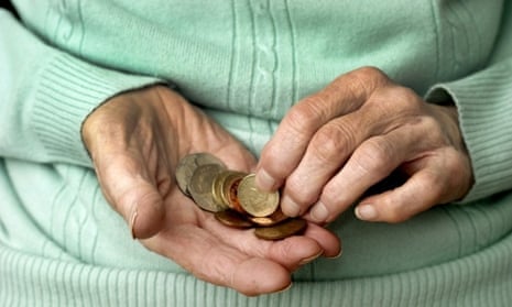 elderly woman counting money in her hand