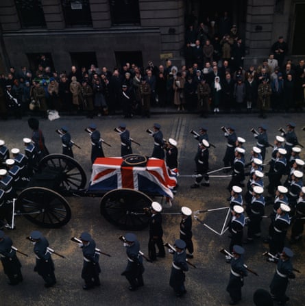 Soldiers escort the coffin decorated with the Order of the Garter